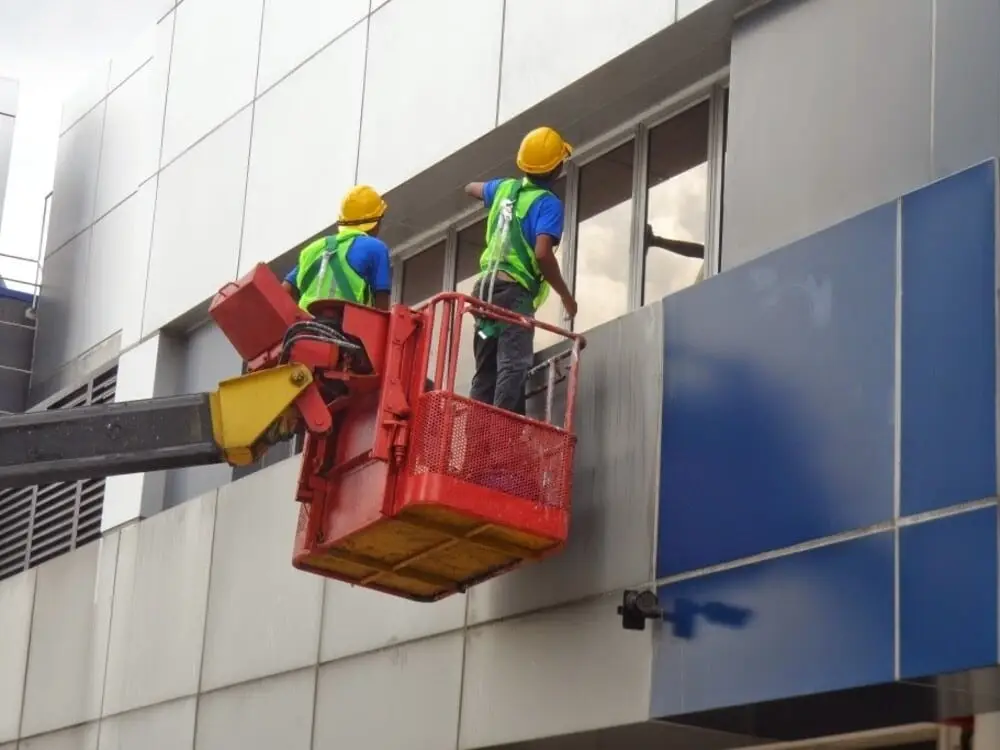 Rope access technician carrying out high-rise exterior work