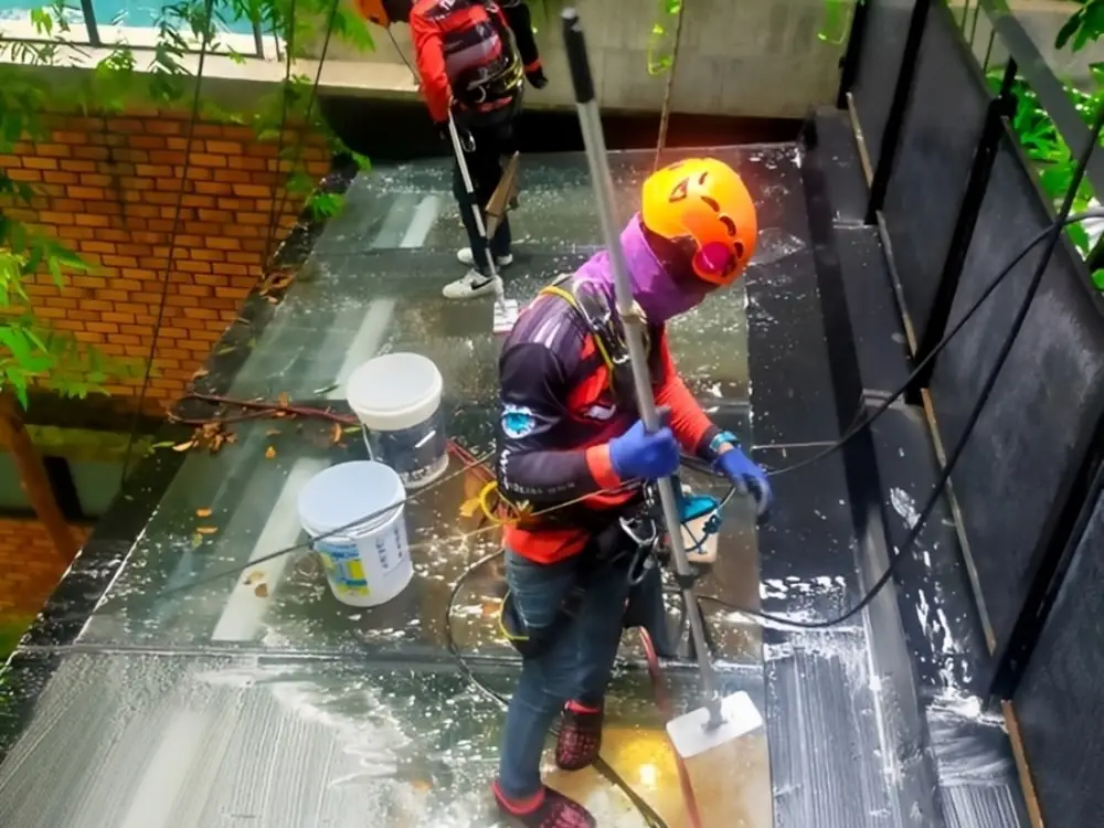 Rope access work around a commercial building signboard