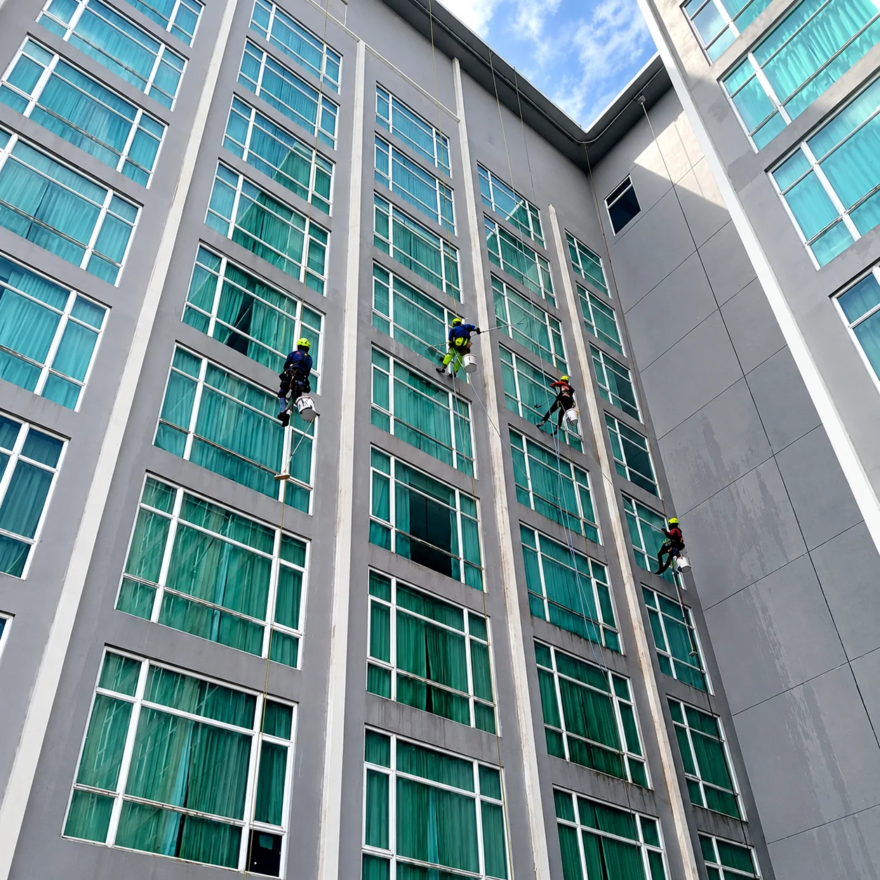 Vertical Pro technician carrying out facade maintenance at height