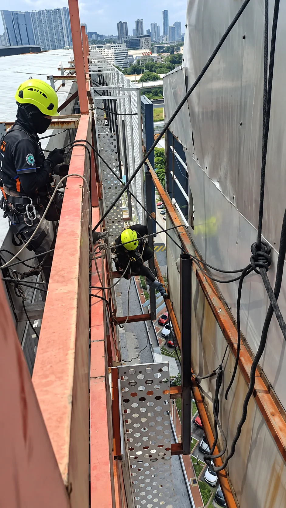 High-rise signboard cleaning using rope access